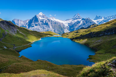 Scenic view of snowcapped mountains against sky