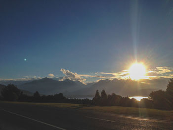 Scenic view of road against sky during sunset