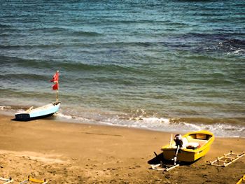 Motorcycle on beach by sea