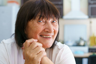 Close-up portrait of smiling young woman