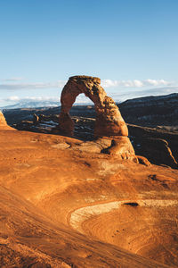 Rock formation on land against sky