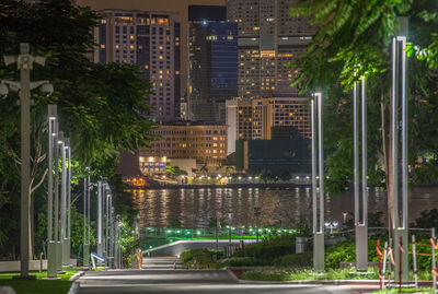 Illuminated buildings by lake