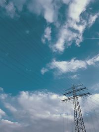 Low angle view of birds flying against sky