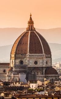 View of temple building against sky during sunset