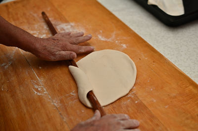 Close-up of preparing dough on cutting board