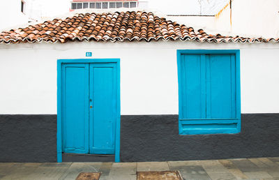 Closed blue door of building