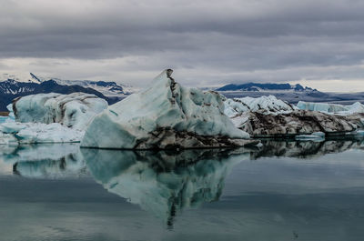 Scenic view of frozen lake against sky