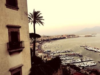 Scenic view of sea and buildings against sky