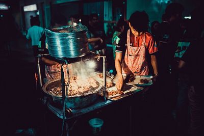 People standing on barbecue grill