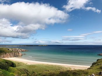 Scenic view of beach against sky