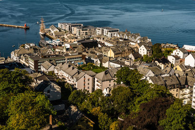 High angle view of townscape by sea