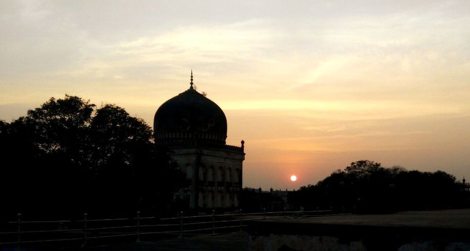 architecture, built structure, building exterior, sunset, place of worship, dome, sky, religion, spirituality, famous place, travel destinations, tree, orange color, tourism, international landmark, travel, church, cloud - sky, history