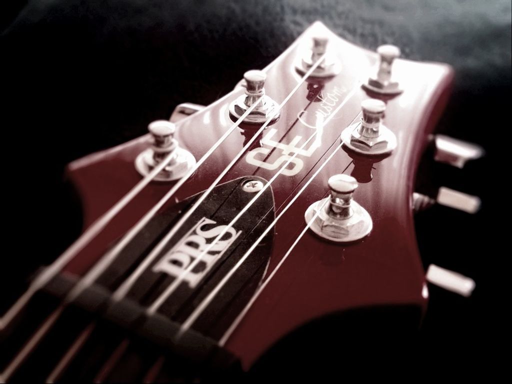 indoors, close-up, music, musical instrument, still life, arts culture and entertainment, focus on foreground, selective focus, technology, musical equipment, guitar, table, no people, musical instrument string, single object, black background, studio shot, metal, part of, old-fashioned