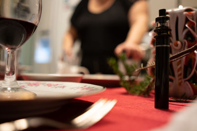 Reflection of wine glass on table at restaurant