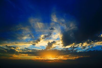 Low angle view of dramatic sky during sunset