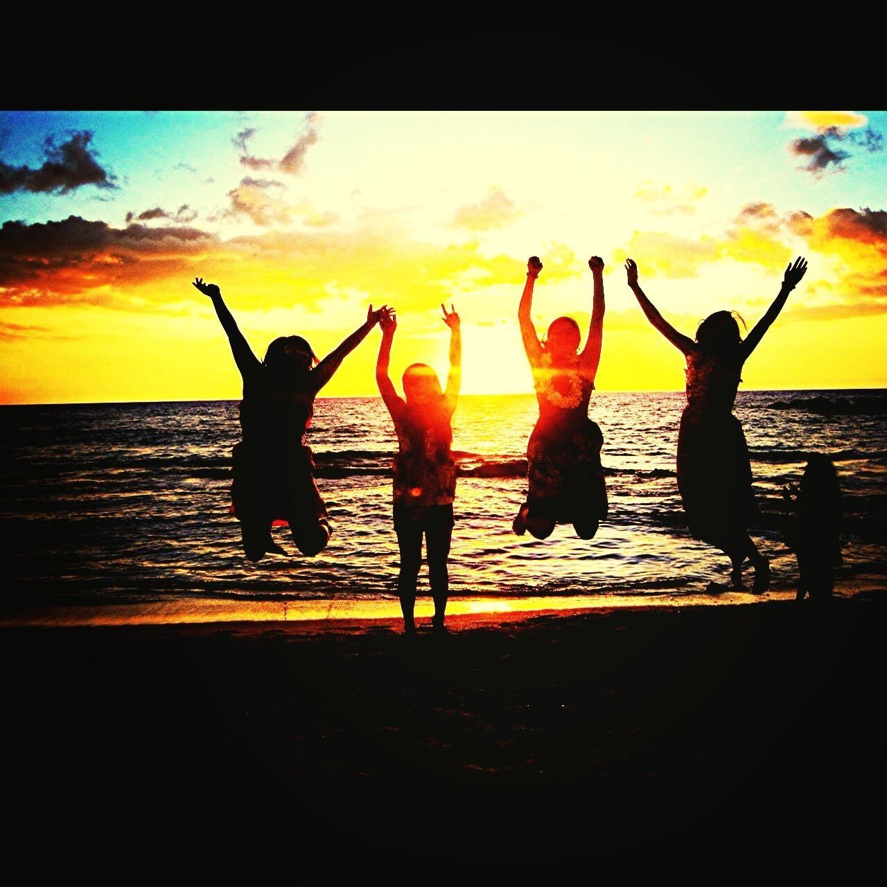 sunset, orange color, lifestyles, silhouette, leisure activity, sea, sky, water, transfer print, togetherness, enjoyment, men, full length, fun, beach, auto post production filter, horizon over water, cloud - sky