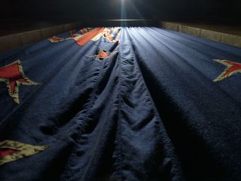 High angle view of man relaxing on bed