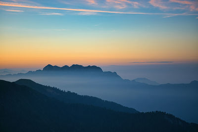 Scenic view of mountains against sky during sunset