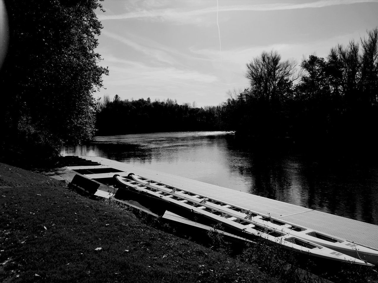 tree, tranquility, sky, water, tranquil scene, lake, bench, nature, empty, absence, scenics, wood - material, beauty in nature, day, river, no people, bare tree, outdoors, non-urban scene, landscape