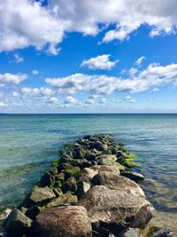 Scenic view of sea against blue sky