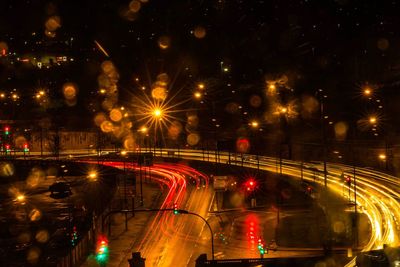 Illuminated city against sky at night