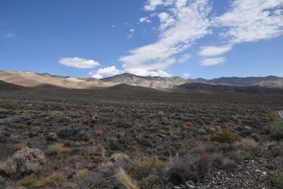 Scenic view of arid landscape against sky