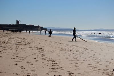 People walking on beach