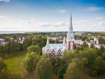 High angle view of trees and buildings against sky