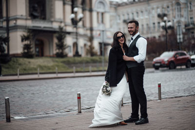 Young couple standing outdoors