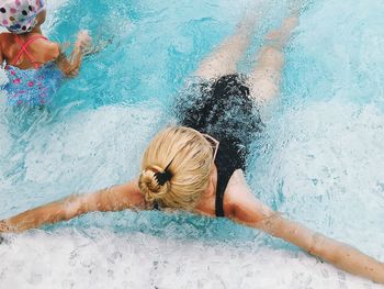 High angle view of woman swimming in pool