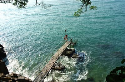 High angle view of rocks by sea