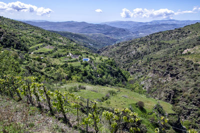 Scenic view of landscape in alpujarra of almería and mountains against sky