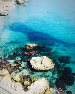 High angle view of rock in sea