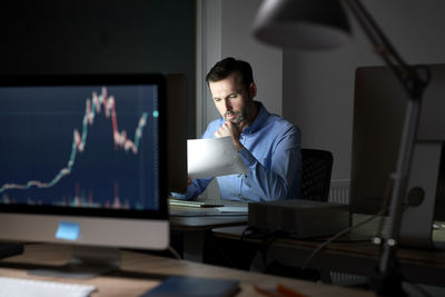 Businessman working late in office