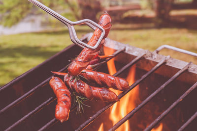 Close-up of sausages on barbecue grill