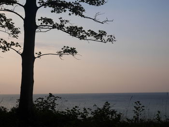 Scenic view of sea against sky at sunset