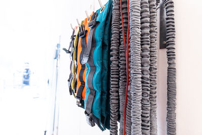 Close-up of multi colored umbrellas hanging in row