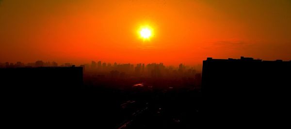 Silhouette of built structure at sunset