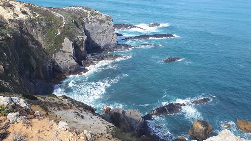 High angle view of rocks in sea