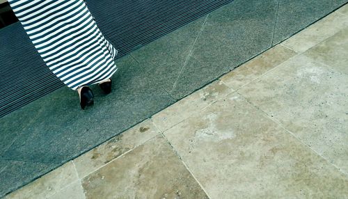 Low section view of woman walking