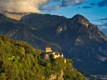 Buildings against mountain range