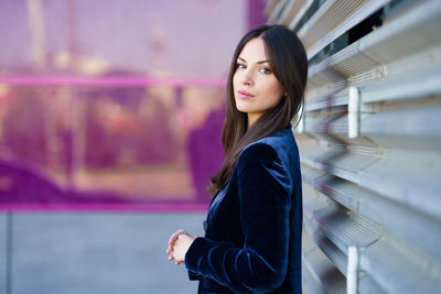 Portrait of beautiful woman standing outdoors