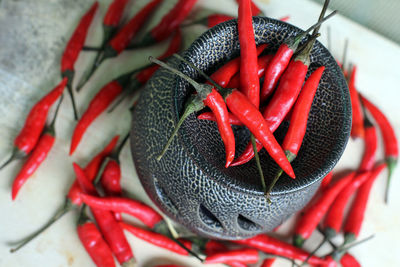 Close-up of red chilies in container