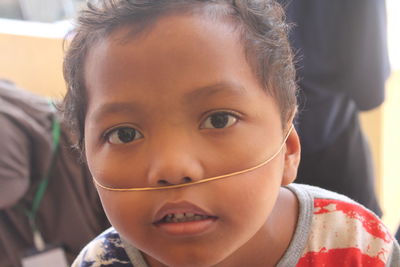 Close-up portrait of cute boy wearing rubber band