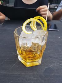 Close-up of cocktail in glass on table at sidewalk cafe