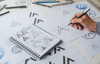 Low angle view of man working on table