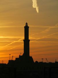 Low angle view of building against sky at sunset