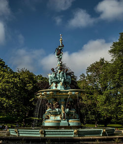 Low angle view of statue against sky