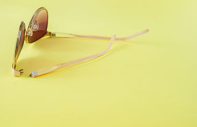 High angle view of yellow eyeglasses on table