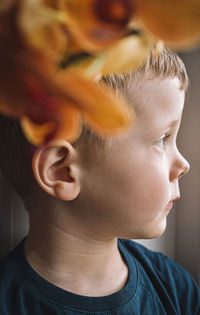 Close-up portrait of boy looking away